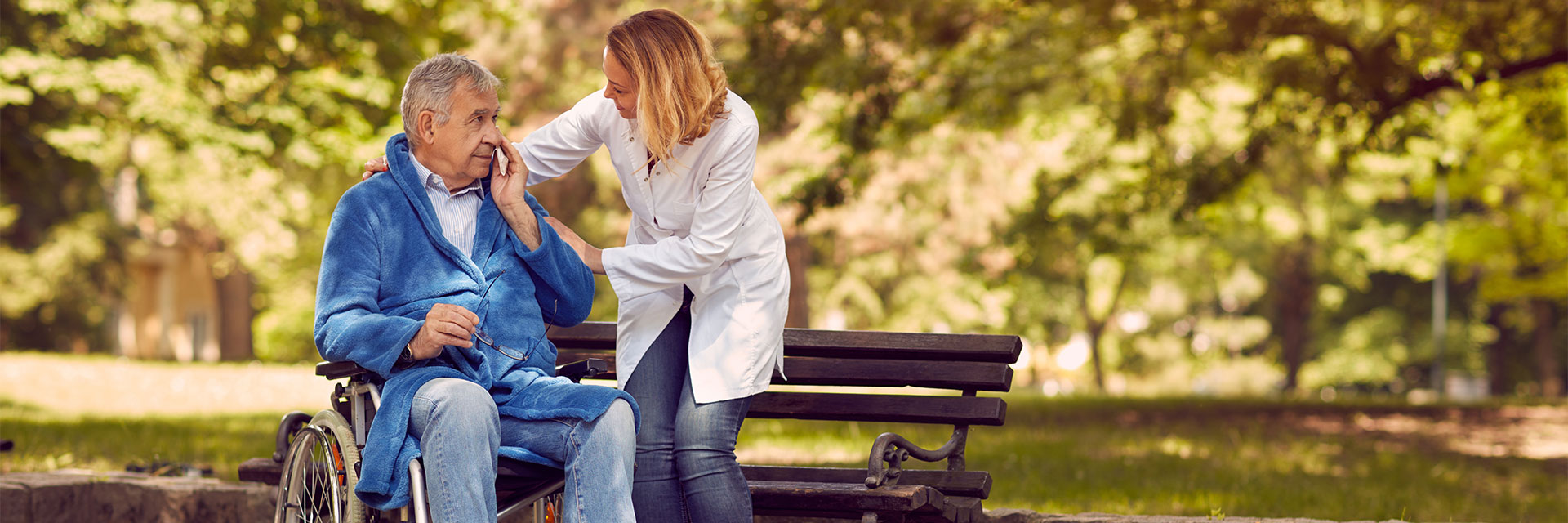 Happy older man outside with nurse